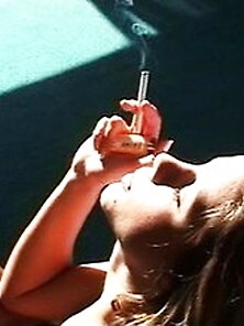 Sexy Chick In A Bra Smoking A Cigarette With...