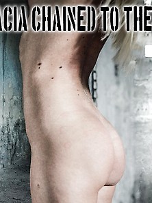 Nude Blonde Girl Chained To The Wall