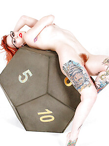 Sexy Tattooed Geeky Nerd Babe On Giant Dice