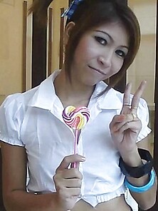 Sexy Schoolgirl Thai Baby Named O Sucks A Lolipop And Shows Off