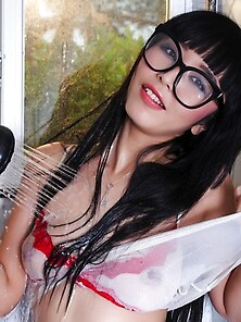 Glasses-Wearing Dark-Haired Chick Eating