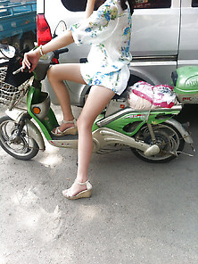 Chinese Milf Riding A Scooter