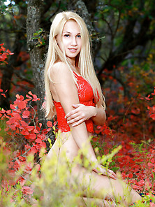 Blonde In Red Gets Naked In The Middle Of A Field Of Red Flowers