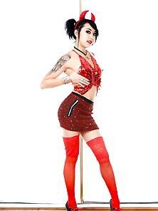Sultry Eastern Girl In A Red Devil Suit Exposes Her Tattooed Bod