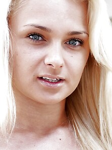 Young Blonde With Beautiful Green Eyes Shows Assets In Provocati