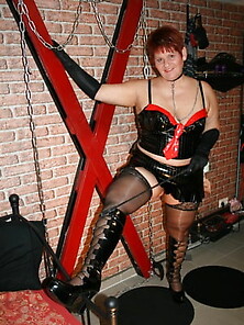 In Latex Paint Outfit On The Cross