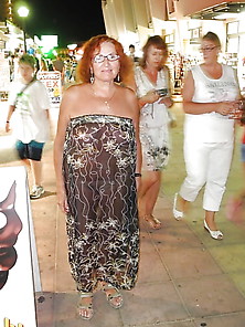 Mature In A Transparent Tunic On The Street