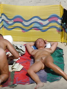 Pair Is Relaxing Nude On The Fkk Beach