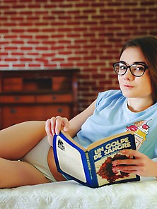 Insatiable Teenager With Sexy Legs Reads A Book And Shows A Hole