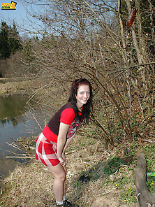Outdoor Pissing On The Dry Grass On A Pond Shore