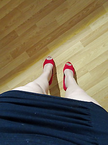 Red High Heels With Nylons And Black Dress