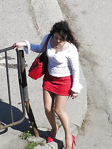 Red Mini Skirt And Heels With Tan Pantyhose On The Street