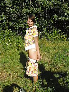Slut Natalie Undresses On Sunny Meadow.